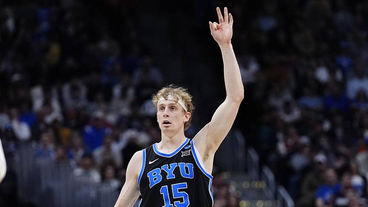 Mar 22, 2025; Denver, CO, USA; Brigham Young Cougars forward Richie Saunders (15) reacts against the Wisconsin Badgers during the first half in the second round of the NCAA Tournament  at Ball Arena. Mandatory Credit: Ron Chenoy-Imagn Images