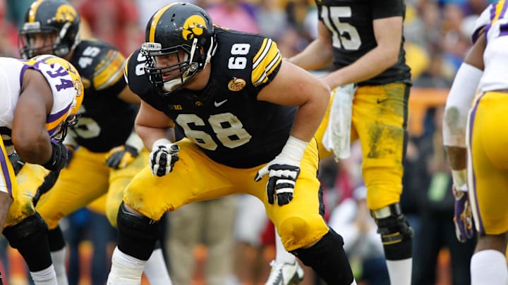 Jan 1, 2014; Tampa, Fl, USA; Iowa Hawkeyes offensive linesman Brandon Scherff (68) blocks against the LSU Tigers during the first half at Raymond James Stadium. Mandatory Credit: Kim Klement-Imagn Images