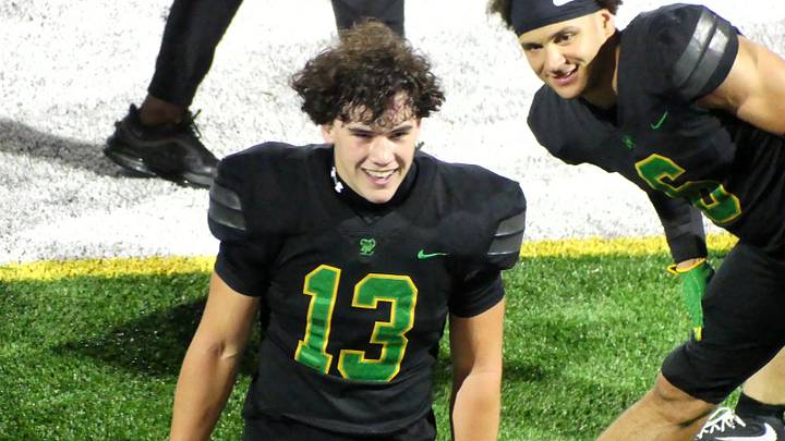 Ashden Marquis (13) looks into the West Linn student section during the Lions' 45-20 season-opening win Friday night.