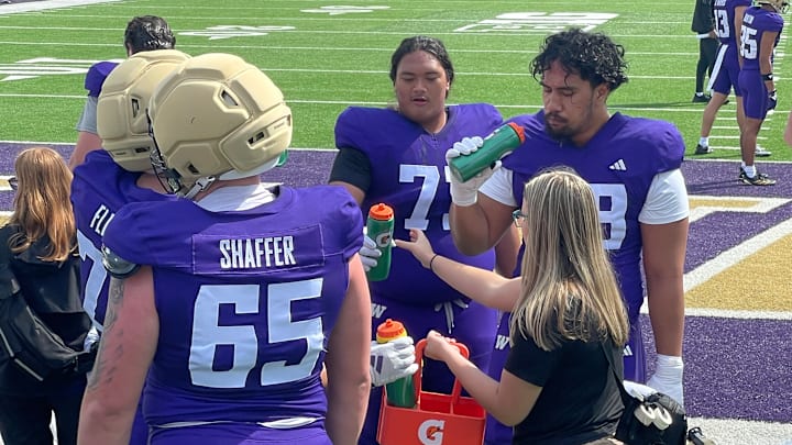 Champ Taulealea, middle, takes a water break. 