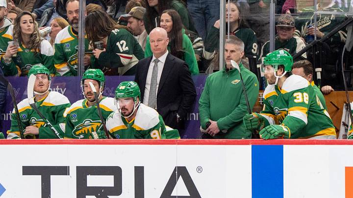 Mar 29, 2025; Saint Paul, Minnesota, USA; Minnesota Wild head coach John Hynes watches play against the New Jersey Devils in the second period at Xcel Energy Center. Mandatory Credit: Matt Blewett-Imagn Images