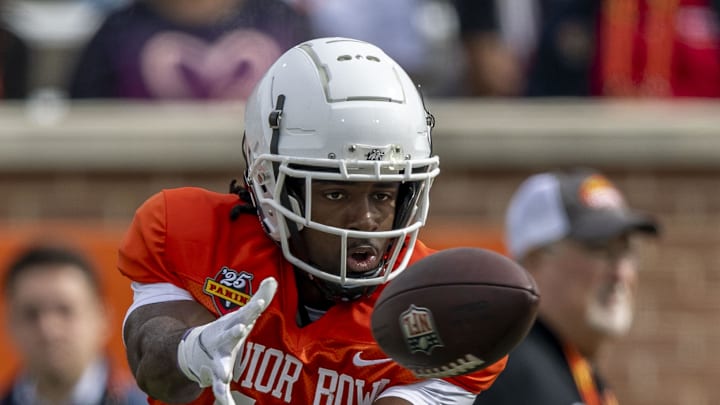 Jan 28, 2025; Mobile, AL, USA; American team wide receiver Jalen Royals of Utah State (17) tracks down a pass during Senior Bowl practice for the American team at Hancock Whitney Stadium. Mandatory Credit: Vasha Hunt-Imagn Images Jan 28, 2025; Mobile, AL, USA; American team wide receiver Jalen Royals of Utah State (17) tracks down a pass during Senior Bowl practice for the American team at Hancock Whitney Stadium. Mandatory Credit: Vasha Hunt-Imagn Images