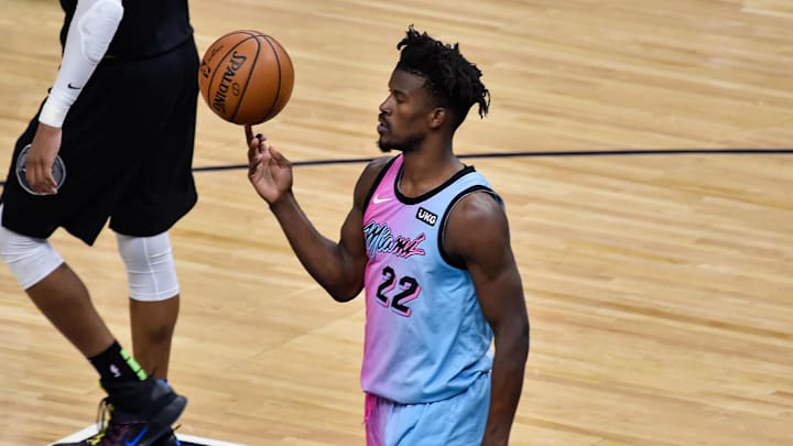 Apr 16, 2021; Minneapolis, Minnesota, USA; Miami Heat forward Jimmy Butler (22) spins the basketball on his finger during the fourth quarter against the Minnesota Timberwolves at Target Center. Mandatory Credit: Jeffrey Becker-Imagn Images