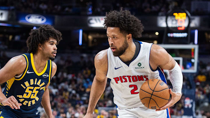 Apr 12, 2026; Indianapolis, Indiana, USA;  Detroit Pistons guard Cade Cunningham (2) dribbles the ball while Indiana Pacers guard Ethan Thompson (55) defends in the second half at Gainbridge Fieldhouse. Mandatory Credit: Trevor Ruszkowski-Imagn Images