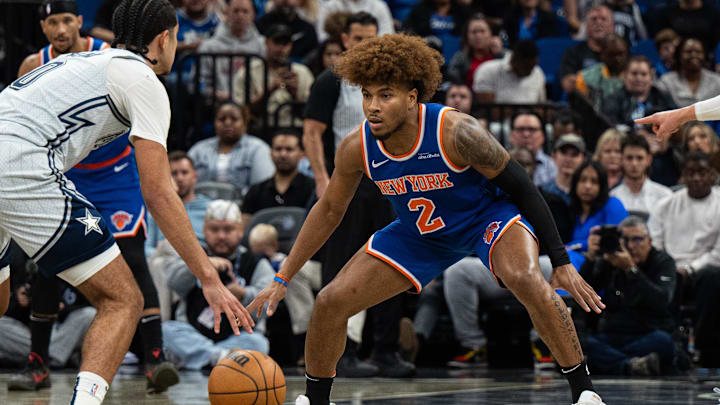 Dec 15, 2024; Orlando, Florida, USA; New York Knicks guard Miles McBride (2) defends Orlando Magic guard Anthony Black (0) in the second quarter at Kia Center. Mandatory Credit: Jeremy Reper-Imagn Images