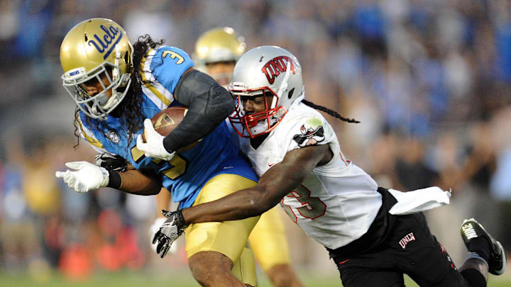 September 10, 2016; Pasadena, CA, USA; UCLA Bruins defensive back Randall Goforth (3) carries the ball after intercepting a pass while being brought down by UNLV Rebels wide receiver Devonte Boyd (83) during the second half at Rose Bowl. Mandatory Credit: Gary A. Vasquez-Imagn Images September 10, 2016; Pasadena, CA, USA; UCLA Bruins defensive back Randall Goforth (3) carries the ball after intercepting a pass while being brought down by UNLV Rebels wide receiver Devonte Boyd (83) during the second half at Rose Bowl. Mandatory Credit: Gary A. Vasquez-Imagn Images