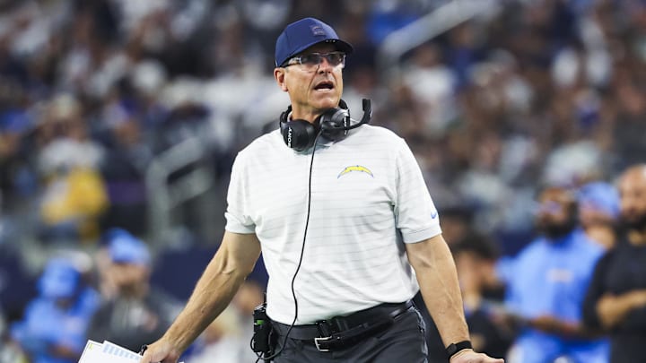 Dec 21, 2025; Arlington, Texas, USA; Los Angeles Chargers head coach Jim Harbaugh reacts to a play against the Dallas Cowboys during the first half at AT&T Stadium. Mandatory Credit: Kevin Jairaj-Imagn Images