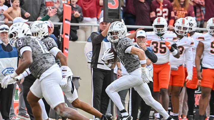 Nov 22, 2025; Blacksburg, Virginia, USA;  Virginia Tech Hokies tight end Ja'Ricous Hairston (13) and Virginia Tech Hokies wide receiver Shamarius Peterkin (15) block for Virginia Tech Hokies wide receiver Ayden Greene (0) as he runs after a catch against the Miami (FL) Hurricanes during the third quarter at Lane Stadium. Mandatory Credit: Brian Bishop-Imagn Images
