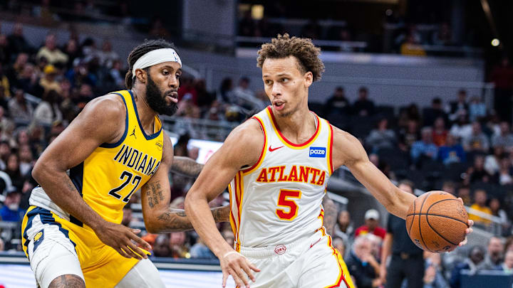 Oct 31, 2025; Indianapolis, Indiana, USA; Atlanta Hawks guard Dyson Daniels (5) dribbles the ball while Indiana Pacers forward Isaiah Jackson (22) defends in the second half at Gainbridge Fieldhouse. Mandatory Credit: Trevor Ruszkowski-Imagn Images