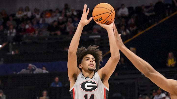 Mar 12, 2025; Nashville, TN, USA; Georgia Bulldogs forward Asa Newell (14) shoots a three point basket against the Oklahoma Sooners during the first half at Bridgestone Arena. Mar 12, 2025; Nashville, TN, USA; Georgia Bulldogs forward Asa Newell (14) shoots a three point basket against the Oklahoma Sooners during the first half at Bridgestone Arena.