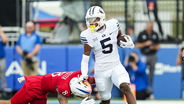Sep 23, 2023; Lawrence, Kansas, USA; Brigham Young Cougars wide receiver Darius Lassiter (5) runs Sep 23, 2023; Lawrence, Kansas, USA; Brigham Young Cougars wide receiver Darius Lassiter (5) runs