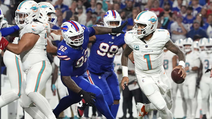 Miami Dolphins quarterback Tua Tagovailoa (1) looks to pass against Buffalo Bills defensive tackle Daquan Jones (92) in the third quarter at Highmark Stadium in Week 3.