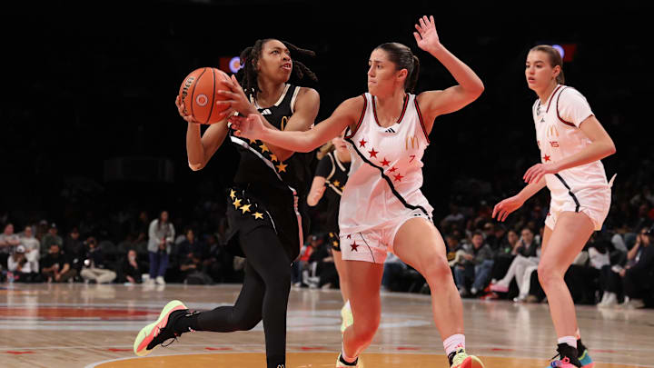 Apr 1, 2025; Brooklyn, NY, USA; McDonald's All American East wing Nyla Brooks (7) drives to the basket against McDonald's All American West guard Addie Deal (7) during the second half of the game at Barclays Center. Mandatory Credit: Pamela Smith-Imagn Images