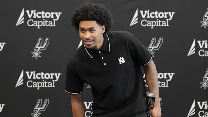 San Antonio first round draft pick Dylan Harper (2) takes a seat before a press conference at Victory Capital Performance Center.