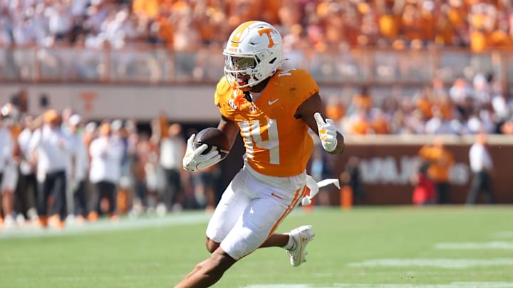 Sep 13, 2025; Knoxville, Tennessee, USA; Tennessee Volunteers wide receiver Braylon Staley (14) runs the ball during the first half against Georgia Bulldogs at Neyland Stadium. Mandatory Credit: Alan Poizner-Imagn Images
