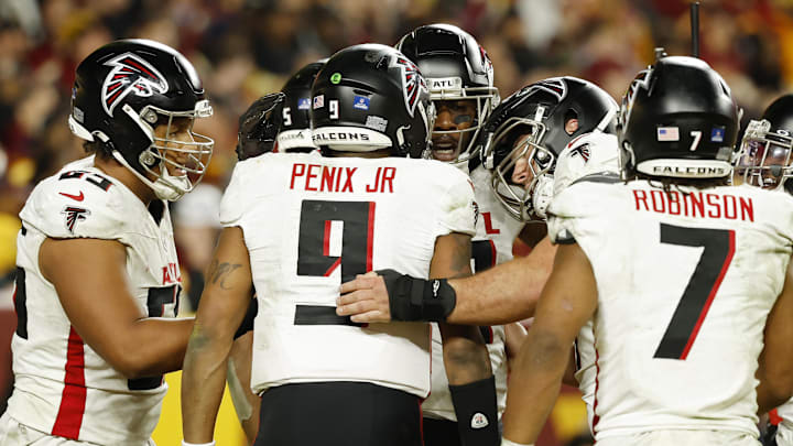 Dec 29, 2024; Landover, Maryland, USA; Atlanta Falcons tight end Kyle Pitts (8) celebrates with teammates after catching a game-tying pass against the Washington Commanders /in the final minutes during the fourth quarter at Northwest Stadium. Mandatory Credit: Geoff Burke-Imagn Images