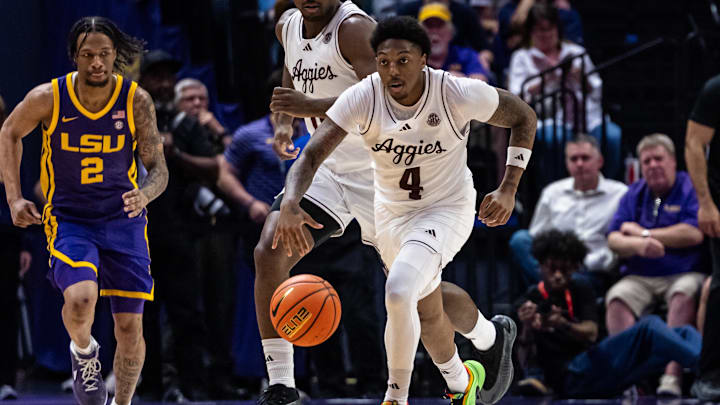 Mar 8, 2025; Baton Rouge, Louisiana, USA; Texas A&M Aggies guard Wade Taylor IV (4) brings the ball up court against LSU Tigers guard Mike Williams III (2) during the second half at Pete Maravich Assembly Center. Mandatory Credit: Stephen Lew-Imagn Images Mar 8, 2025; Baton Rouge, Louisiana, USA; Texas A&M Aggies guard Wade Taylor IV (4) brings the ball up court against LSU Tigers guard Mike Williams III (2) during the second half at Pete Maravich Assembly Center. Mandatory Credit: Stephen Lew-Imagn Images