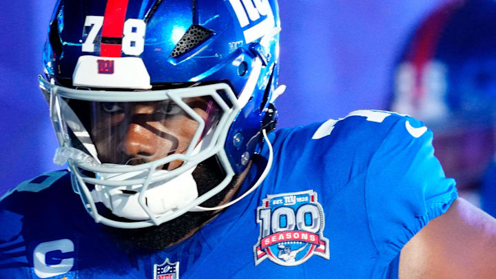 New York Giants offensive tackle Andrew Thomas (78) and his teammates run onto the field moments before kickoff, Sunday, October 13, 2024, in East Rutherford.