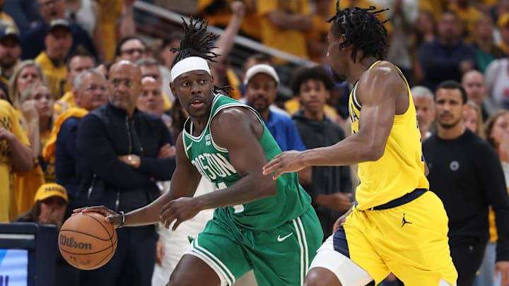 May 25, 2024; Indianapolis, Indiana, USA; Boston Celtics guard Jrue Holiday (4) brings the ball up court against Indiana Pacers forward Aaron Nesmith (23) during the fourth quarter of game three of the eastern conference finals in the 2024 NBA playoffs at Gainbridge Fieldhouse. Mandatory Credit: Trevor Ruszkowski-USA TODAY Sports