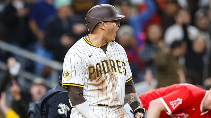 May 13, 2025; San Diego, California, USA; San Diego Padres third baseman Manny Machado (13) celebrates after scoring a run during the eighth inning against the Los Angeles Angels at Petco Park. Mandatory Credit: David Frerker-Imagn Images