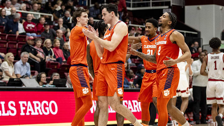 Feb 4, 2026; Stanford, California, USA;  Clemson Tigers forward Nick Davidson (11), guard Dillon Hunter (2) and other players celebrate after defeating Stanford Cardinal at Maples Pavilion. Mandatory Credit: John Hefti-Imagn Images