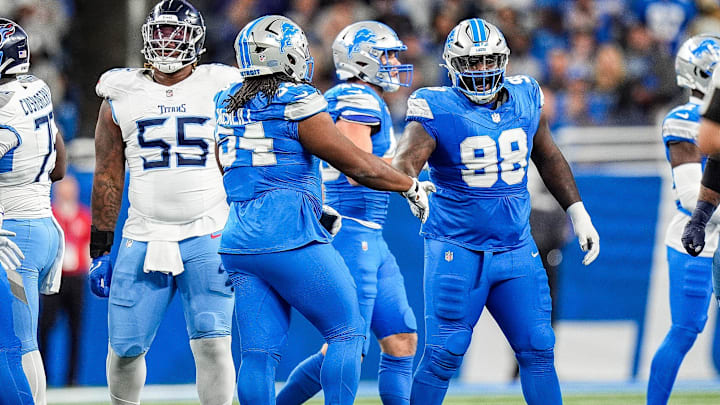 Detroit Lions defensive tackle Alim McNeill (54) shakes hands with defensive tackle DJ Reader (98). Detroit Lions defensive tackle Alim McNeill (54) shakes hands with defensive tackle DJ Reader (98).