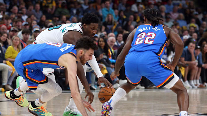 Apr 24, 2025; Memphis, Tennessee, USA; Memphis Grizzlies forward Jaren Jackson Jr. (13) dribbles as Oklahoma City Thunder forward Chet Holmgren (7) and Oklahoma City Thunder guard Cason Wallace (22) defend during the second quarter during game three for the first round of the 2024 NBA Playoffs at FedExForum. Mandatory Credit: Petre Thomas-Imagn Images Apr 24, 2025; Memphis, Tennessee, USA; Memphis Grizzlies forward Jaren Jackson Jr. (13) dribbles as Oklahoma City Thunder forward Chet Holmgren (7) and Oklahoma City Thunder guard Cason Wallace (22) defend during the second quarter during game three for the first round of the 2024 NBA Playoffs at FedExForum. Mandatory Credit: Petre Thomas-Imagn Images