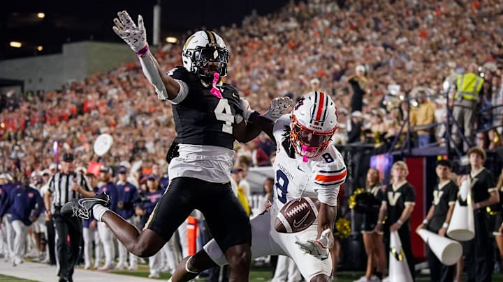 Auburn wide receiver Cam Coleman (8) receives a pass to pull in a touchdown past Vanderbilt cornerback Martel Hight (4) during the fourth quarter at FirstBank Stadium in Nashville, Tenn., Saturday, Nov. 8, 2025.