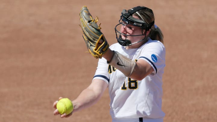 Michigan starting pitcher Lauren Derkowski (18) pitches against Northern Colorado in a softball game