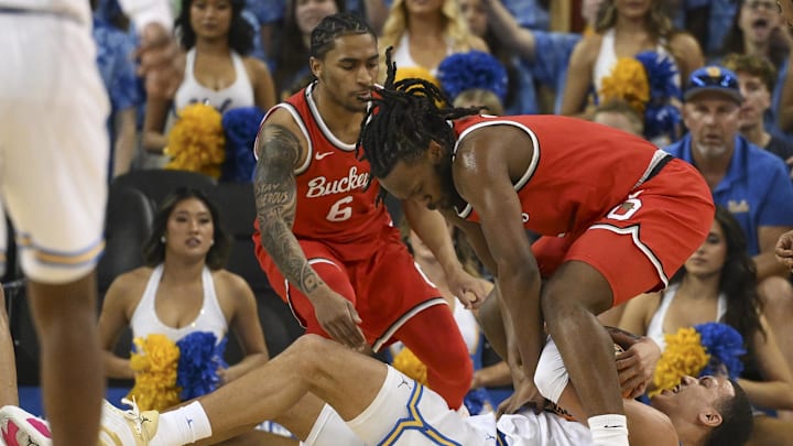 Feb 23, 2025; Los Angeles, California, USA; UCLA Bruins guard Kobe Johnson (0), Ohio State Buckeyes guard Ques Glover (6) and guard Bruce Thornton (2) fight for a loose ball during the first half at Pauley Pavilion presented by Wescom. Mandatory Credit: Robert Hanashiro-Imagn Images