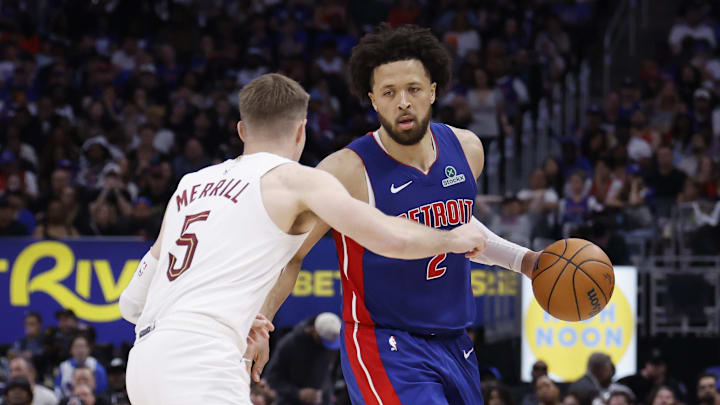 May 17, 2026; Detroit, Michigan, USA; Detroit Pistons guard Cade Cunningham (2) dribbles against Cleveland Cavaliers guard Sam Merrill (5) in the second half during game seven of the second round of the 2026 NBA Playoffs at Little Caesars Arena. Mandatory Credit: Rick Osentoski-Imagn Images