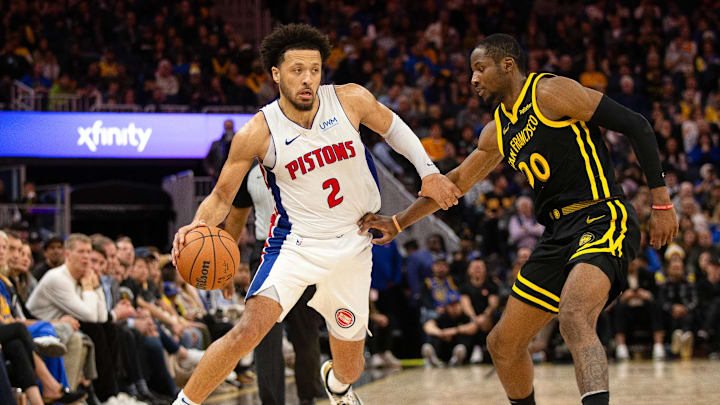 Jan 5, 2024; San Francisco, California, USA; Detroit Pistons guard Cade Cunningham (2) drives around Golden State Warriors guard Stephen Curry (30) during the fourth quarter at Chase Center. Mandatory Credit: D. Ross Cameron-Imagn Images