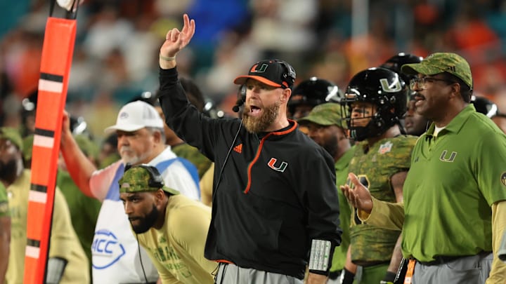 Oct 25, 2025; Miami Gardens, Florida, USA; Miami Hurricanes defensive coordinator Corey Hetherman reacts on the sideline against the Stanford Cardinal during the fourth quarter at Hard Rock Stadium. Mandatory Credit: Sam Navarro-Imagn Images Oct 25, 2025; Miami Gardens, Florida, USA; Miami Hurricanes defensive coordinator Corey Hetherman reacts on the sideline against the Stanford Cardinal during the fourth quarter at Hard Rock Stadium. Mandatory Credit: Sam Navarro-Imagn Images