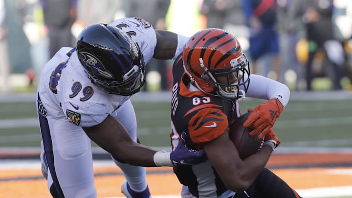 Nov 10, 2019; Cincinnati, OH, USA; Cincinnati Bengals wide receiver Tyler Boyd (83) is brought down by Baltimore Ravens outside linebacker Matt Judon (99) during the second half at Paul Brown Stadium. Mandatory Credit: David Kohl-Imagn Images