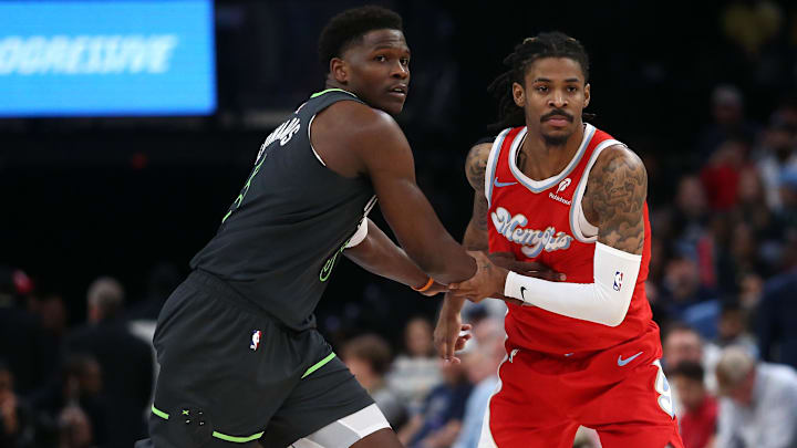 Apr 10, 2025; Memphis, Tennessee, USA; Minnesota Timberwolves guard Anthony Edwards (5) and Memphis Grizzlies guard Ja Morant (12) battle for position during the third quarter at FedExForum. Mandatory Credit: Petre Thomas-Imagn Images Apr 10, 2025; Memphis, Tennessee, USA; Minnesota Timberwolves guard Anthony Edwards (5) and Memphis Grizzlies guard Ja Morant (12) battle for position during the third quarter at FedExForum. Mandatory Credit: Petre Thomas-Imagn Images