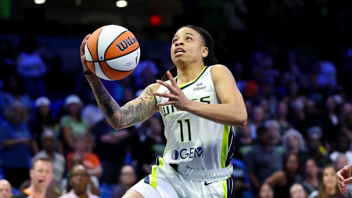 Dallas Wings guard JJ Quinerly drives to the basket against the Phoenix Mercury.