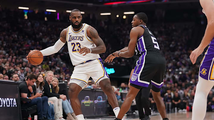 Oct 29, 2023; Sacramento, California, USA; Los Angeles Lakers forward LeBron James (23) dribbles the ball next to Sacramento Kings guard De'Aaron Fox (5) in the first quarter at the Golden 1 Center. Mandatory Credit: Cary Edmondson-Imagn Images