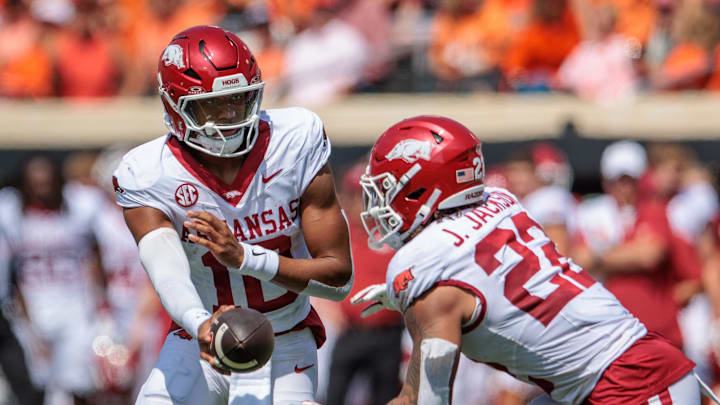Sep 7, 2024; Stillwater, Oklahoma, USA; Arkansas Razorbacks quarterback Taylen Green (10) hands off to Arkansas Razorbacks running back Ja'Quinden Jackson (22) during the second quarter against the Oklahoma State Cowboys at Boone Pickens Stadium. Mandatory Credit: William Purnell-Imagn Images
