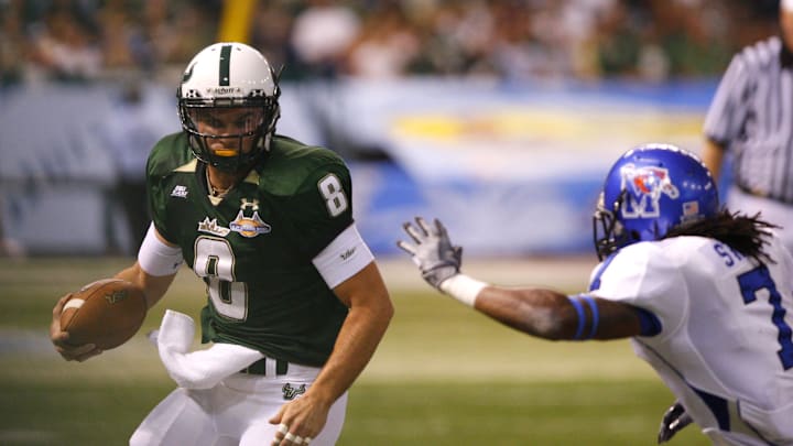December 20, 2008; St. Petersburg FL, USA; Memphis Tigers defensive back Alton Starr (7) tackles South Florida Bulls quarterback Matt Grothe (8) during the first half of the 2008 St. Pete Bowl at Tropican Field. Mandatory Credit: Kim Klement-USA TODAY Sports