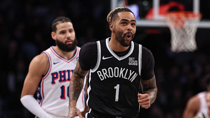 Jan 4, 2025; Brooklyn, New York, USA; Brooklyn Nets guard D'Angelo Russell (1) reacts after making a basket during the first quarter against the Philadelphia 76ers at Barclays Center. Mandatory Credit: Vincent Carchietta-Imagn Images