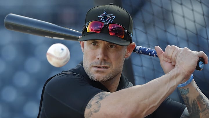 Miami Marlins manager Skip Schumaker (45) hits ground balls during batting practice before a game against the Pittsburgh Pirates at PNC Park on Sept 10.