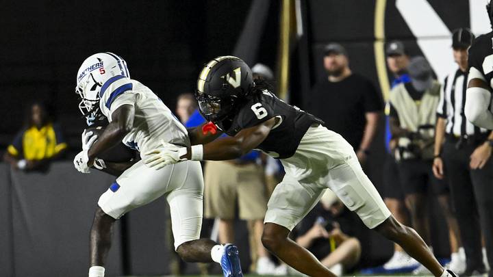 Sep 20, 2025; Nashville, Tennessee, USA; Vanderbilt Commodores cornerback Jordan Matthews (6) tackles Georgia State Panthers wide receiver Javon Robinson (5) for a loss during the first half at FirstBank Stadium. Mandatory Credit: Steve Roberts-Imagn Images Sep 20, 2025; Nashville, Tennessee, USA; Vanderbilt Commodores cornerback Jordan Matthews (6) tackles Georgia State Panthers wide receiver Javon Robinson (5) for a loss during the first half at FirstBank Stadium. Mandatory Credit: Steve Roberts-Imagn Images