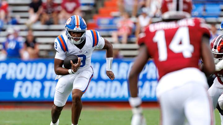 Oct 10, 2026; Gainesville, Florida, USA; Florida Gators quarterback Tramell Jones Jr. (9) runs with the ball towards South Carolina Gamecocks defensive back J'Zavien Currence (14) during the second half at Ben Hill Griffin Stadium. Mandatory Credit: Matt Pendleton-Imagn Images Oct 10, 2026; Gainesville, Florida, USA; Florida Gators quarterback Tramell Jones Jr. (9) runs with the ball towards South Carolina Gamecocks defensive back J'Zavien Currence (14) during the second half at Ben Hill Griffin Stadium. Mandatory Credit: Matt Pendleton-Imagn Images