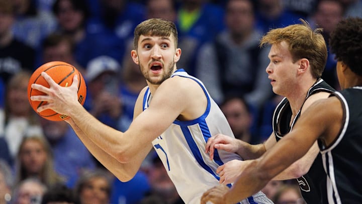 Dec 31, 2024; Lexington, Kentucky, USA; Kentucky Wildcats forward Andrew Carr (7) holds the ball during the first half against the Brown Bears at Rupp Arena at Central Bank Center. Mandatory Credit: Jordan Prather-Imagn Images