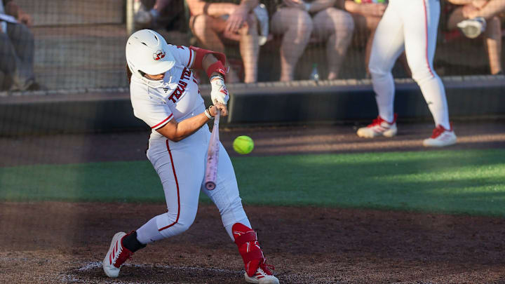 Texas Tech's Jasmyn Burns (12) hits the ball during a Big 12 Conference softball game, Friday, March 13, 2026, at Rocky Johnson Field.
