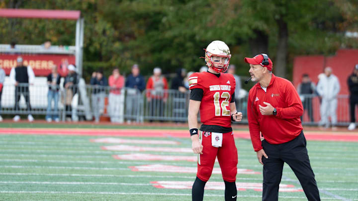 Oct 25, 2025; Oradell, New Jersey, USA; St. Joes football at Bergen Catholic. Bergen Catholic head coach Vito Campanile talks with #12 Trey Tagliaferri.