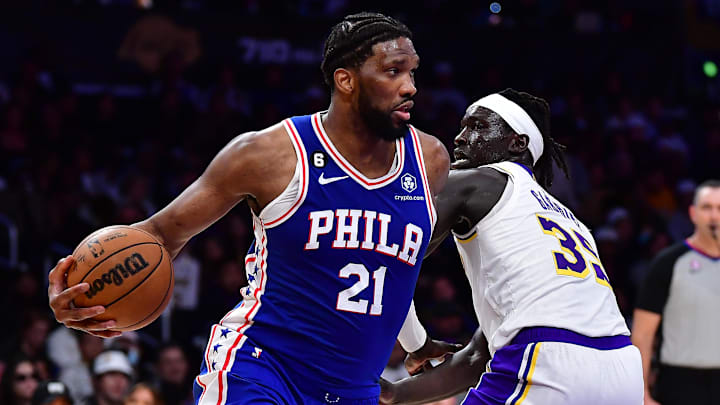 Jan 15, 2023; Los Angeles, California, USA; Philadelphia 76ers center Joel Embiid (21) moves the ball against Los Angeles Lakers forward Wenyen Gabriel (35) during the first half at Crypto.com Arena. Mandatory Credit: Gary A. Vasquez-Imagn Images