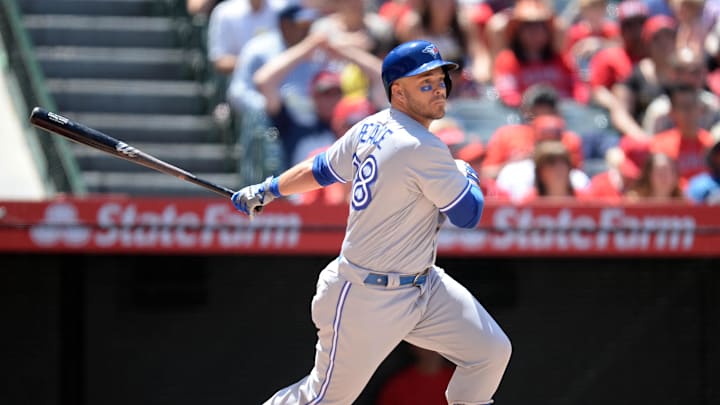 June 24, 2018; Anaheim, CA, USA; Toronto Blue Jays designated hitter Steve Pearce (28) hits a single in the fifth inning against the Los Angeles Angels  at Angel Stadium of Anaheim. Mandatory Credit: Gary A. Vasquez-Imagn Images