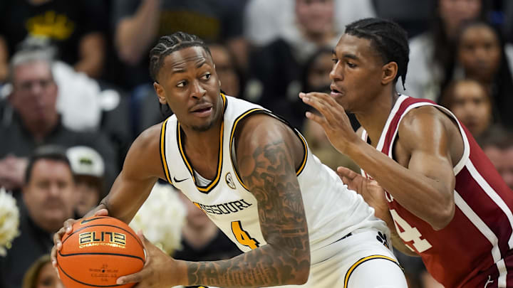 Feb 12, 2025; Columbia, Missouri, USA; Missouri Tigers guard Marcus Allen (4) looks to pass against Oklahoma Sooners forward Jalon Moore (14) during the second half at Mizzou Arena. Mandatory Credit: Jay Biggerstaff-Imagn Images Feb 12, 2025; Columbia, Missouri, USA; Missouri Tigers guard Marcus Allen (4) looks to pass against Oklahoma Sooners forward Jalon Moore (14) during the second half at Mizzou Arena. Mandatory Credit: Jay Biggerstaff-Imagn Images