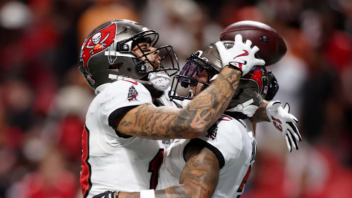 Sep 7, 2025; Atlanta, Georgia, USA; Tampa Bay Buccaneers wide receiver Mike Evans (13) celebrates with wide receiver Emeka Egbuka (2) after a touchdown against the Atlanta Falcons during the fourth quarter at Mercedes-Benz Stadium. Mandatory Credit: Brett Davis-Imagn Images